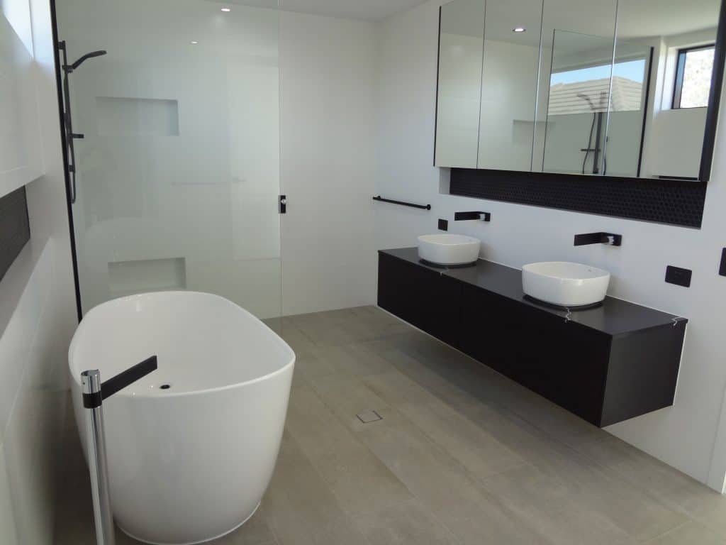 New Bathroom Remodel with black fitting & bathtub - Plumbing Gladstone